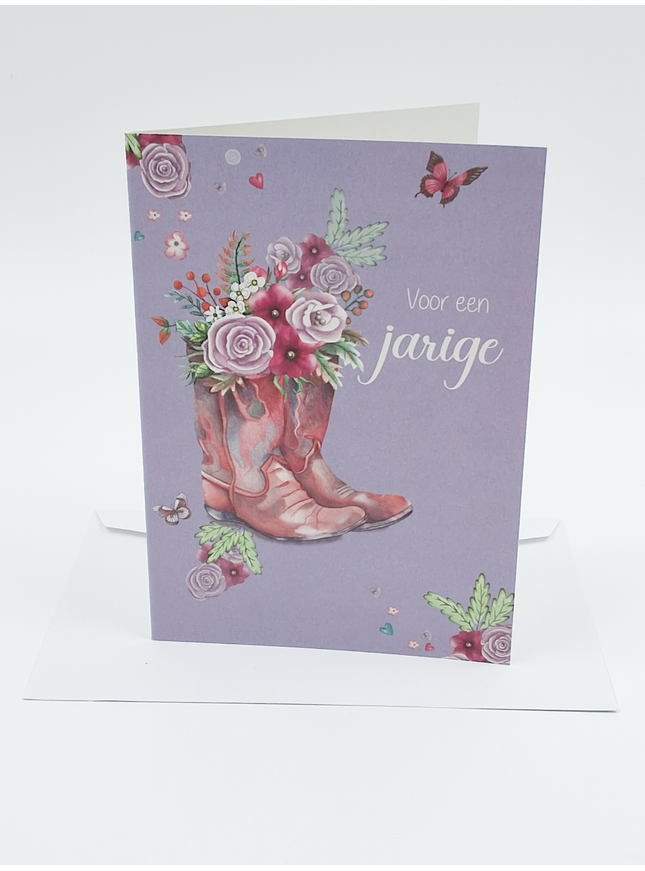 Carte d'anniversaire avec une botte