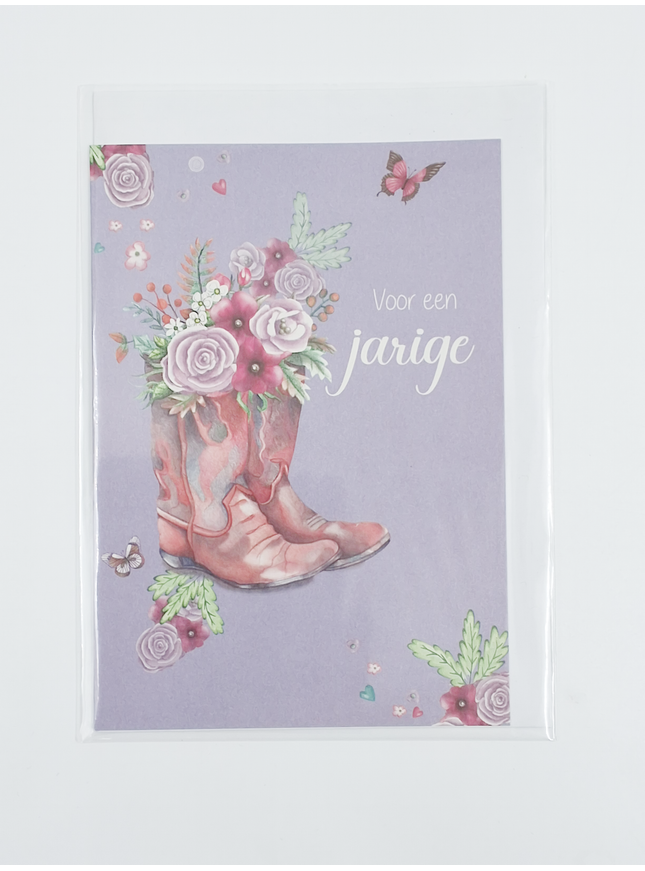 Carte d'anniversaire avec une botte